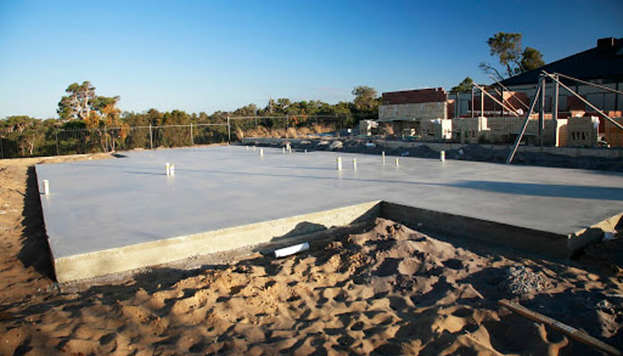 A liquid termite chemical barrier is the best defence for a slab-on-ground foundation on sandy soil.